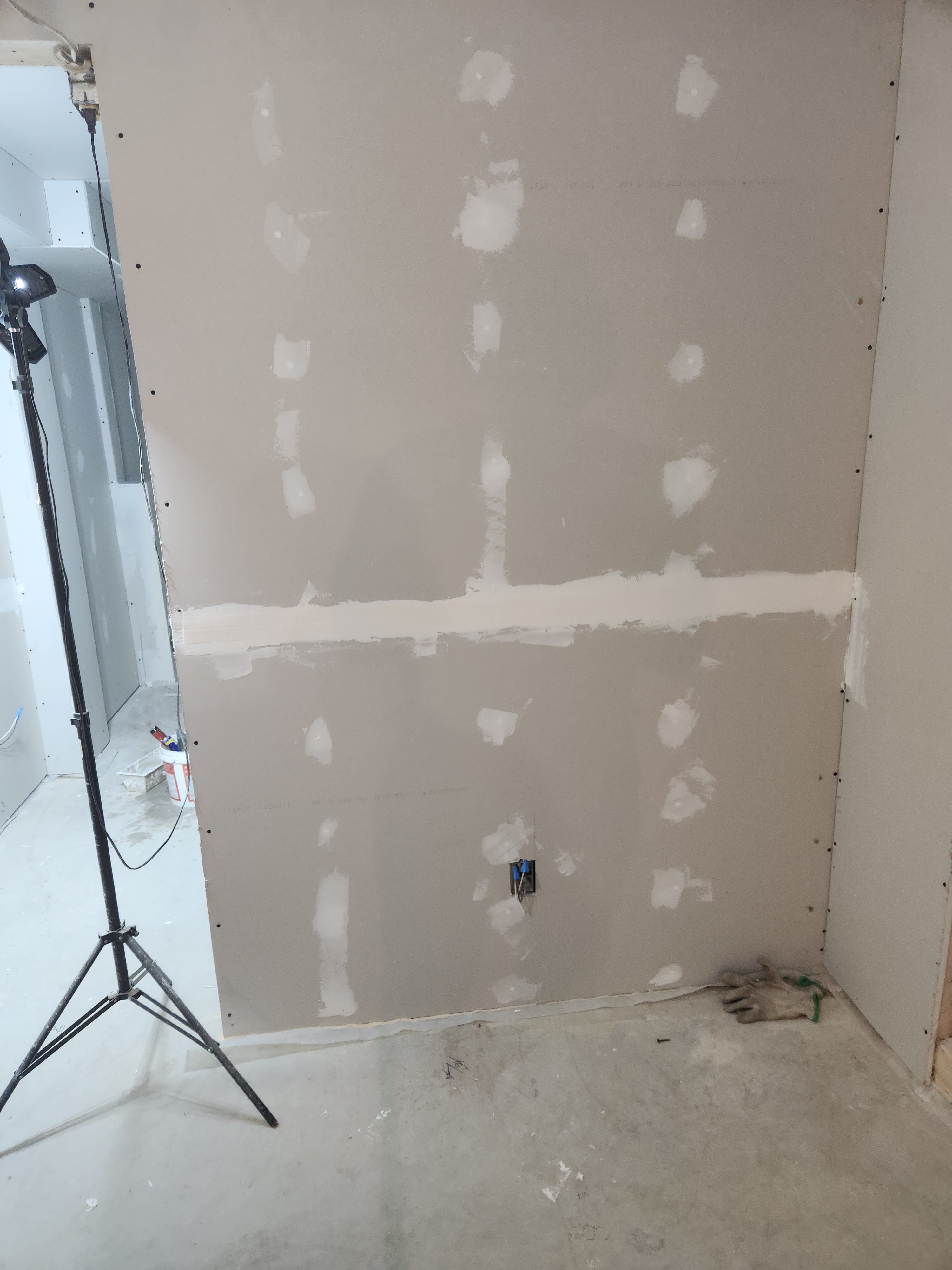 Residential renovation drywall work showing before and after installation and finishing